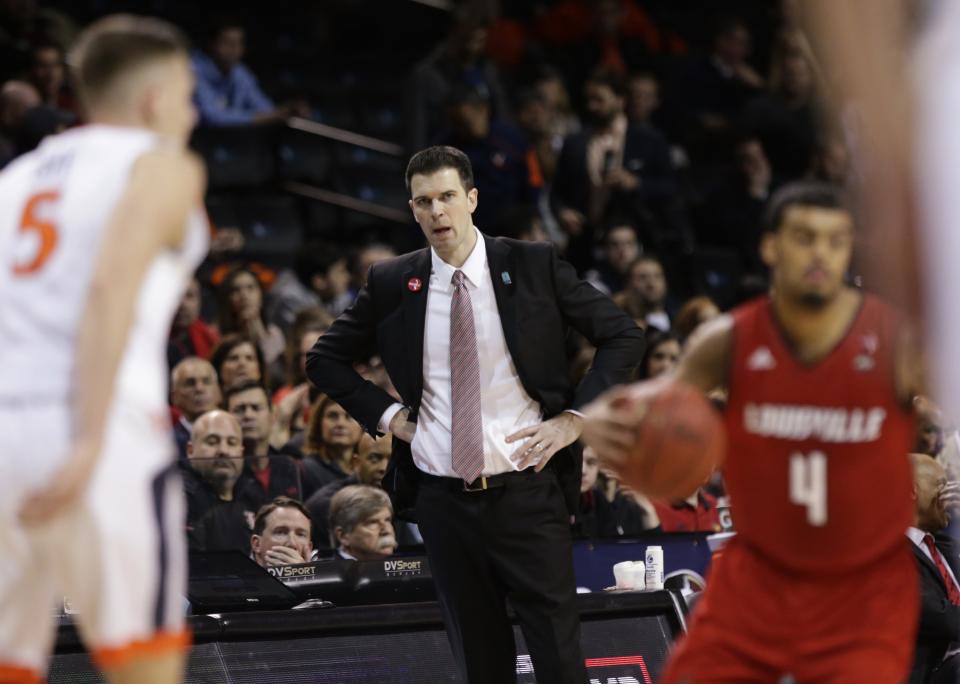 Louisville head coach David Padgett watches his team play during the first half of an NCAA college basketball game against Virginia in the quarterfinal round of the Atlantic Coast Conference tournament Thursday, March 8, 2018, in New York. (AP Photo/Frank Franklin II)