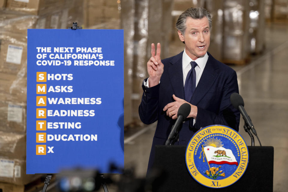 Gov. Gavin Newsom announces the next phase of California's COVID-19 response called "SMARTER," during a press conference at the UPS Healthcare warehouse in Fontana, Calif. on Thursday, Feb. 17, 2022. California Gov. Gavin Newsom on Thursday announced the first shift by a state to an “endemic” approach to the coronavirus pandemic that emphasizes prevention and quick reactions to outbreaks over mandates, a milestone nearly two years in the making that harkens to a return to a more normal existence. (Watchara Phomicinda/The Orange County Register via AP)