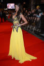 <b>Judi Shekoni</b><br><br>Show stopping but not the most stylish look, Judi flaunts a flouncy yellow skirt and very low cut neckline.