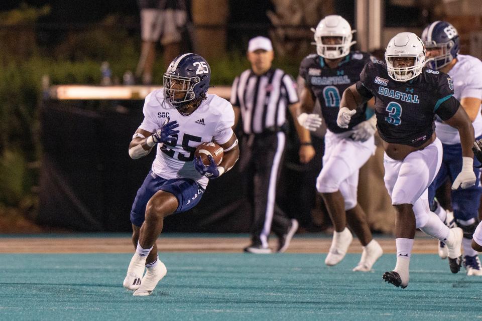 Georgia Southern Eagles running back Jalen White (25) runs the ball in the second quarter against the Coastal Carolina Chanticleers on Saturday night at Brooks Stadium. [DAVID YEAZELL/USA TODAY Sports]