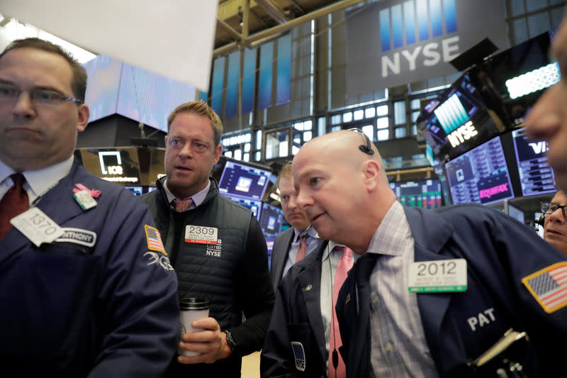 Traders work on the floor of the New York Stock Exchange shortly after the opening bell in New York, U.S., May 14, 2018. REUTERS/Lucas Jackson