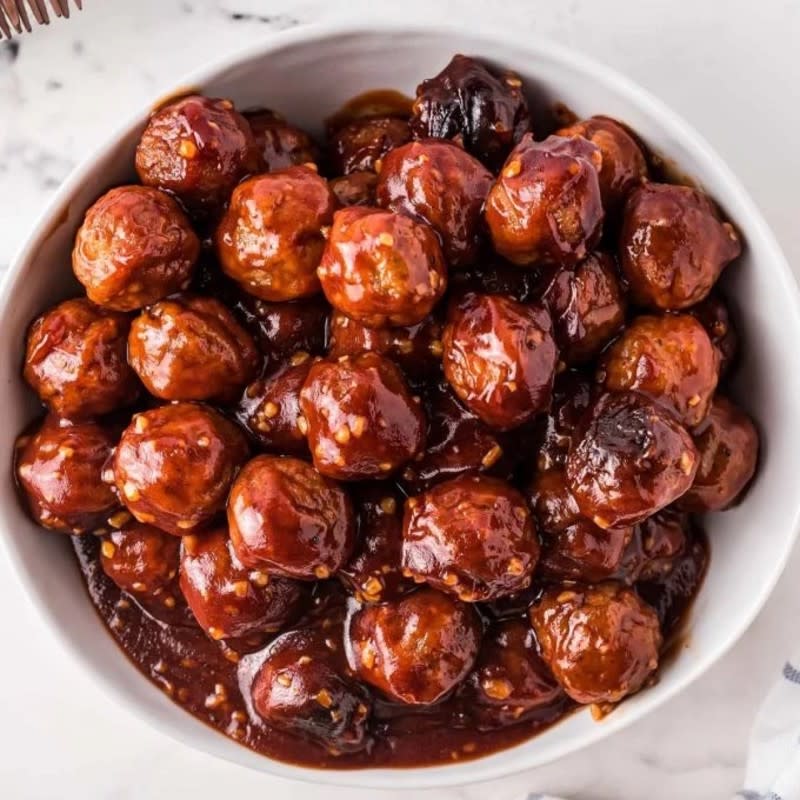 <p>The Chunky Chef</p><p>These meatballs are smothered in a flavorful honey garlic barbecue sauce.</p><p><strong>Get the recipe: <a href="https://www.thechunkychef.com/honey-garlic-crockpot-meatballs/" rel="nofollow noopener" target="_blank" data-ylk="slk:Honey Garlic Crock Pot Meatballs;elm:context_link;itc:0;sec:content-canvas" class="link ">Honey Garlic Crock Pot Meatballs</a></strong></p><p><strong>Related: 45 <a href="https://www.yahoo.com/lifestyle/45-comfort-food-recipes-winter-221215480.html" data-ylk="slk:Comfort Food Recipes;elm:context_link;itc:0;sec:content-canvas;outcm:mb_qualified_link;_E:mb_qualified_link;ct:story;" class="link  yahoo-link">Comfort Food Recipes</a></strong></p>