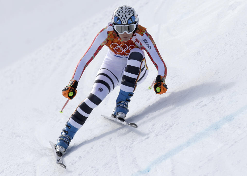 Germany's Maria Hoefl-Riesch makes a turn during the downhill portion of the women's supercombined at the Sochi 2014 Winter Olympics, Monday, Feb. 10, 2014, in Krasnaya Polyana, Russia. (AP Photo/Luca Bruno)
