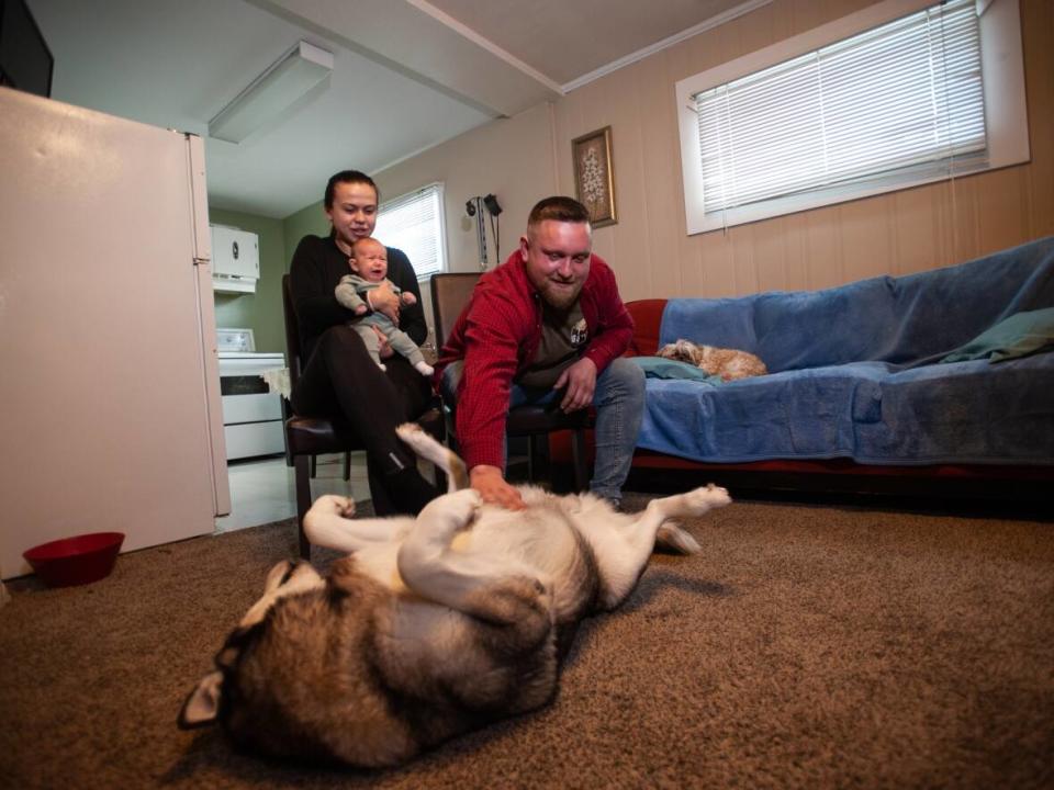 Kyrylo and Marianna Bozchenko pictured in their home in Whitehorse. The couple has chosen to settle in the Yukon after leaving Ukraine because of the war. (Julien Gignac/CBC - image credit)