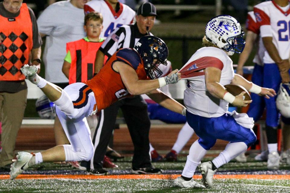 Harrison's Evan Powell (87) brings down Kokomo's Evan Barker (4) during the second quarter of an IHSAA football game, Friday, Oct. 8, 2021 in West Lafayette.