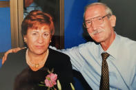 This undated photo provided by the family in April 2020 shows Enrico Giacomoni and his wife, Giulia Chiodi. The last time Roberto Giacomoni saw his 80-year-old father Enrico, he gently helped him up from bed, put his socks, shoes and jacket on, and walked him out to the paramedics who had come to take him to the hospital because he was having trouble breathing. (Courtesy of Giacomoni family via AP)