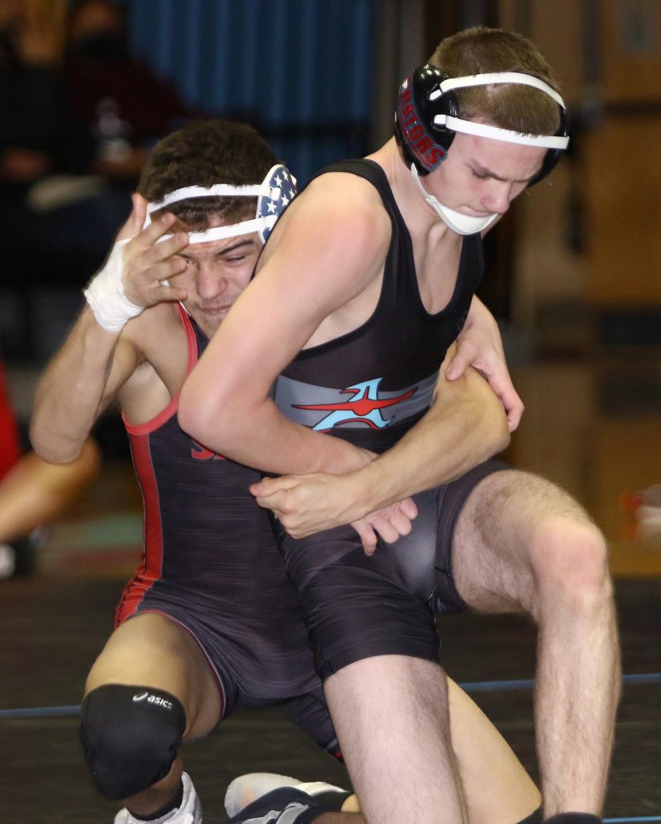 Alliance's Shaun Richer, right, and Salem's Brittan Allen during their 132-pound match at Alliance High School Thursday, January 27, 2022.