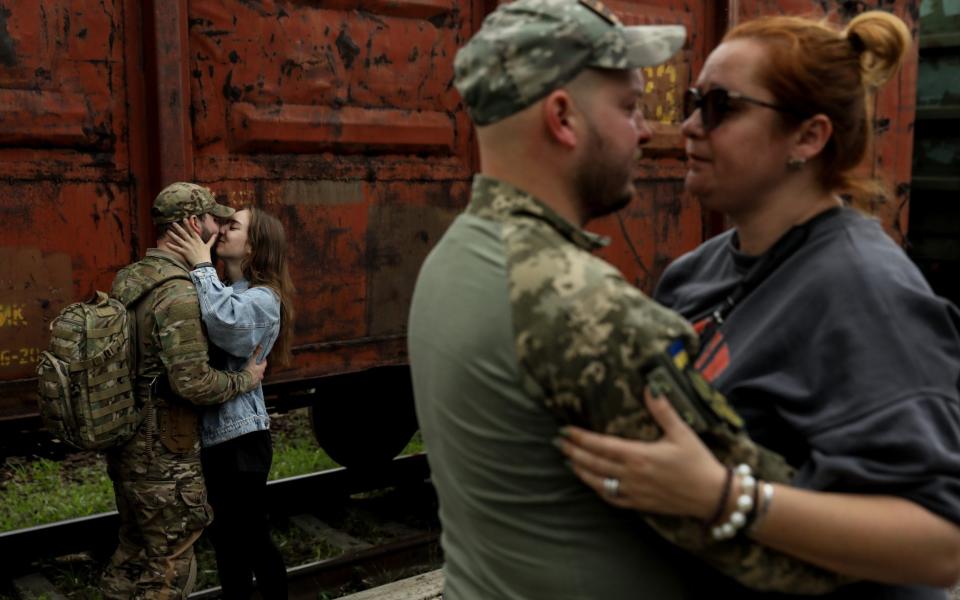 Couples bid each other farewell at the railway station in Kramatorsk, Donetsk region - OLEG PETRASYUK/EPA-EFE/Shutterstock/Shutterstock