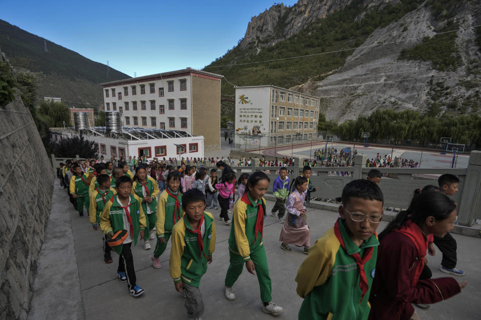 Tibetan students head to a canteen for their meals at the Shangri-La Key Boarding School during a media-organized tour in Dabpa county, Kardze Prefecture, Sichuan province, China on Sept. 5, 2023. (AP Photo/Andy Wong)