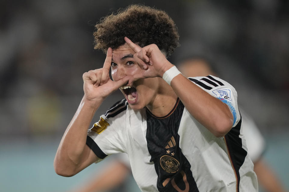 Germany's Noah Darvich celebrates after scoring his team's second goal during the U-17 World Cup final soccer match between Germany and France at Manahan Stadium in Surakarta, Indonesia, Saturday, Dec. 2, 2023. (AP Photo/Achmad Ibrahim)