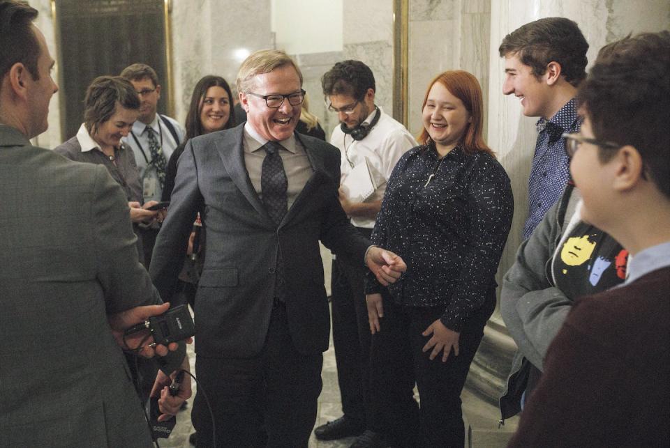 David Eggen, NDP education minister at the time, walks with kids on his way to speak about the passing of Alberta’s gay-straight alliance bill in Edmonton in 2017. THE CANADIAN PRESS/Jason Franson