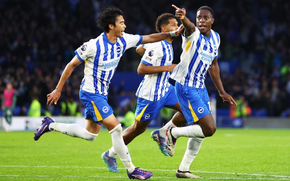 Danny Welbeck celebrates scoring Brighton's winner with Kaoru Mitoma