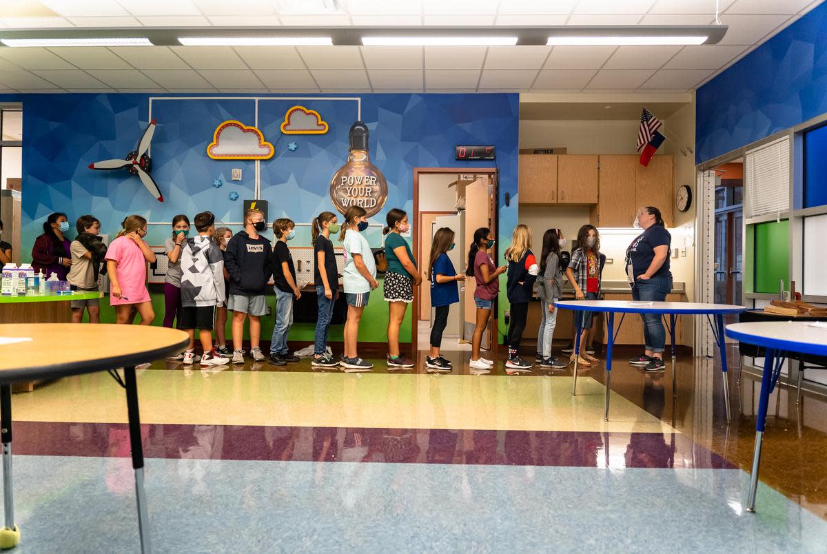 Fifth graders at Jacob’s Well Elementary School in Wimberley lineup at the door as they prepare to walk back to their classroom from the science lab on Sept. 4, 2020.