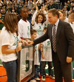 Michigan State coach Tom Izzo greets children participating in the Camouflage for Kids program