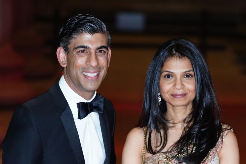 Rishi Sunak alongside his wife Akshata Murthy have both been criticised for her tax status (PA Wire)