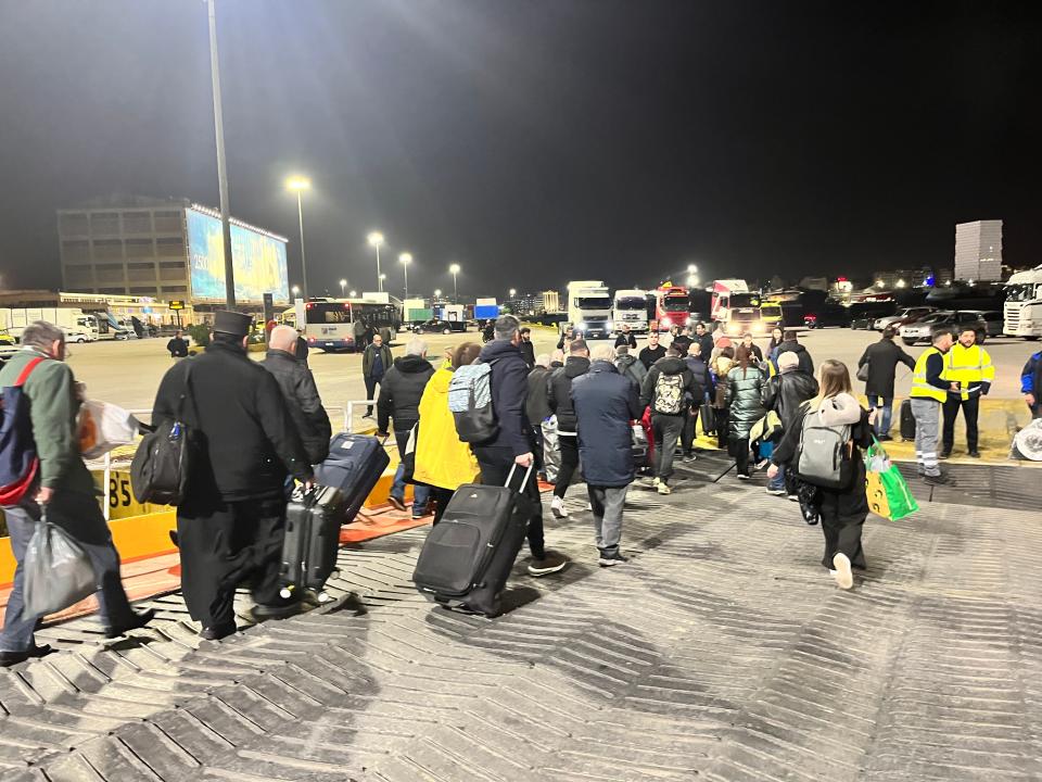 people disembarking a ship in athens