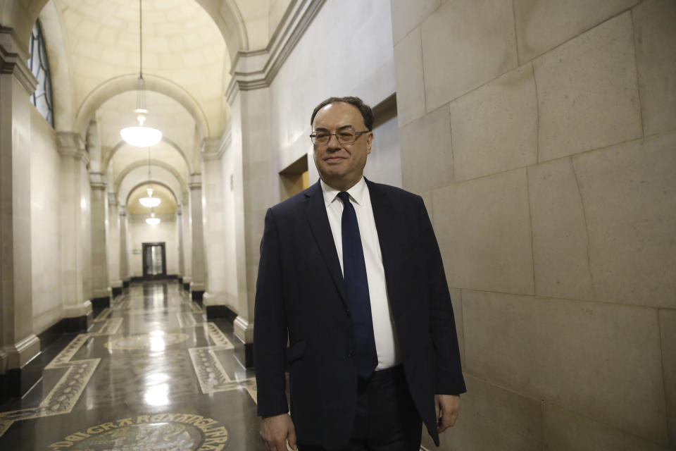 The new Bank of England Governor Andrew Bailey poses for a photograph on the first day of his new role at the central bank in London, Monday March 16, 2020. Andrew Bailey is replacing Mark Carney. (Tolga Akmen/Pool via AP)