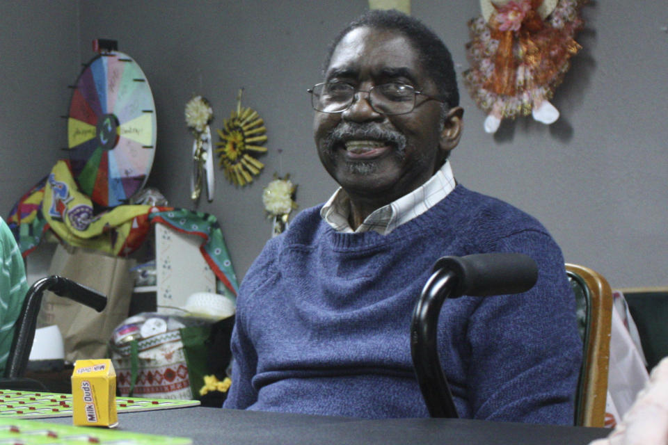 Jay Cossey plays bingo with other residents during activity time at The Retreat at Kenwood assisted living facility in Texarkana, Texas on Friday, May 17, 2024. The former lawyer moved here after multiple strokes more than seven years ago that caused him to lose most of his short-term memory. He’s one of a handful of Black residents at a facility that is blocks away from his old apartment. (AP Photo/Mallory Wyatt)