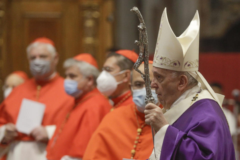 FILE - In this file photo dated Sunday, Nov. 29, 2020, Pope Francis holds his pastoral staff as he arrives to celebrate Mass, at St. Peter's Basilica. The Vatican has confirmed that Pope Francis received the first shot of the ant-COVID vaccine on Thursday. No visuals of the 84-yer-old pontiff receiving the shot have been released. The pope has advocated that everyone should get the vaccine, calling it an “ethical option” performed not only for one’s own health but for the “lives of others.” (AP Photo/Gregorio Borgia, FILE)