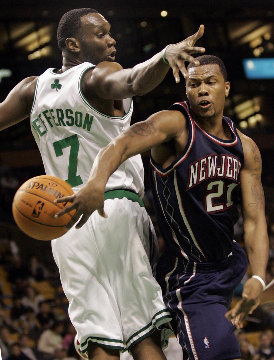 FILE - Boston Celtics' Al Jefferson (7) tries to stop New Jersey Nets' Antoine Wright (21) during the first quarter of an NBA basketball game in Boston, in this Wednesday, Oct. 18, 2006, file photo. Eighteen former NBA players, including Wright, have been indicted on charges alleging they defrauded the league's health and welfare benefit plan out of about $4 million, according to an indictment Thursday. (AP Photo/Chitose Suzuki, File)