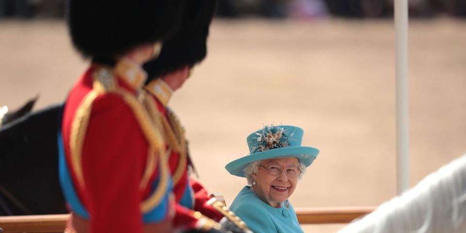 <p>Queen Elizabeth smiles at Prince William as he marches during Trooping the Colour ceremony. </p>