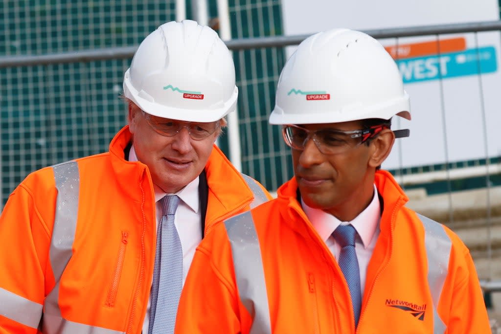 Boris Johnson and Rishi Sunak visit a construction site. Campaigners say government spending plans will result in rising emissions   (Getty Images)
