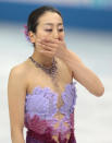 Mao Asada of Japan leaves the ice after competing in the women's team short program figure skating competition at the Iceberg Skating Palace during the 2014 Winter Olympics, Saturday, Feb. 8, 2014, in Sochi, Russia. (AP Photo/Ivan Sekretarev)