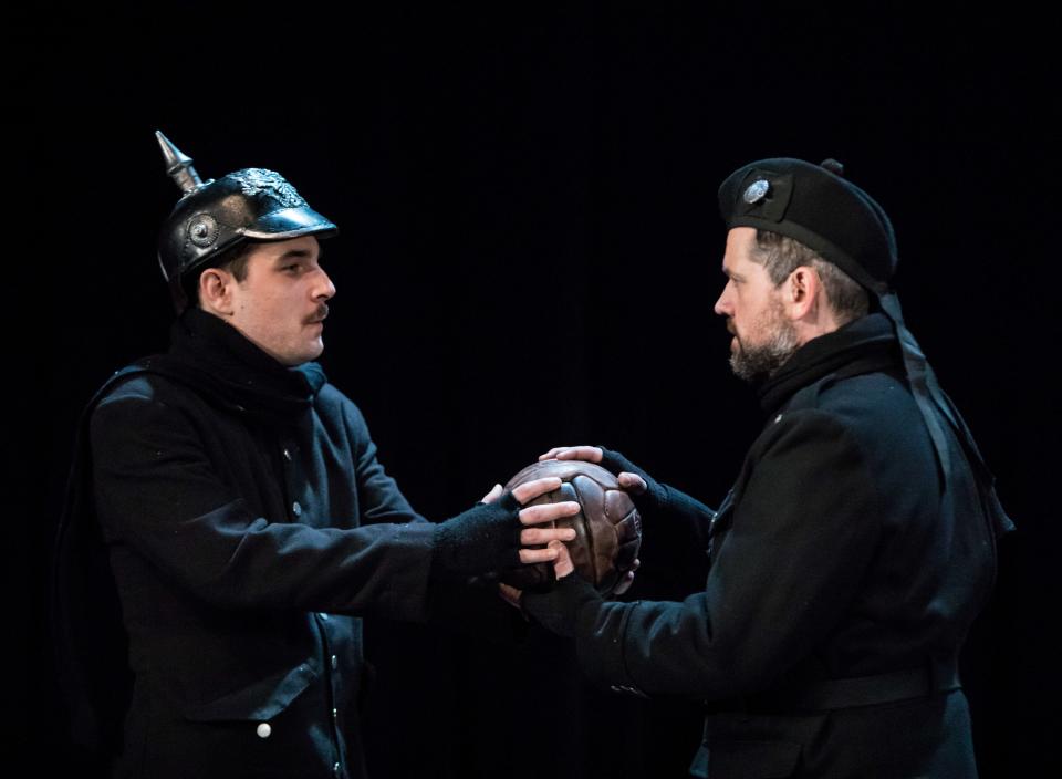 A German soldier (Benjamin Dutcher, left) and a British counterpart (Andrew Wilkowske) share a moment in “All Is Calm: The Christmas Truce of 1914.”