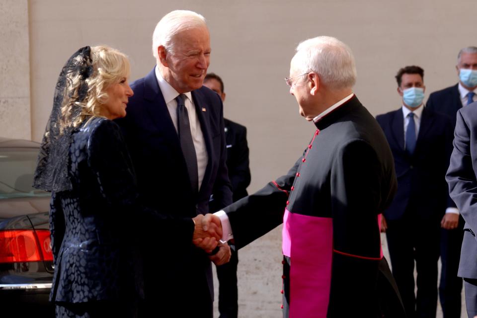 U.S. President Joe Biden and First lady Jill Biden are received by Msgr Leonardo Sapienza, Regent of the Prefecture of the Papal Household, as they arrive at the San Damaso Courtyard for a meeting with Pope Francis at the Apostolic Palace on October 29, 2021 in Vatican City, Vatican.