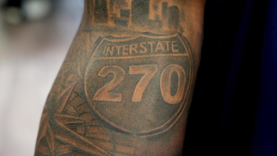 Farleigh Dickinson forward Sean Moore has an I-270 highway sign among the tattoos on his right arm.