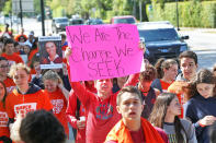 <p>Students take part in a national walkout to protest gun violence at Marjory Stone Douglas High School on March 14, 2018 in Parkland, Fla.<br> (Photo: Getty Images) </p>