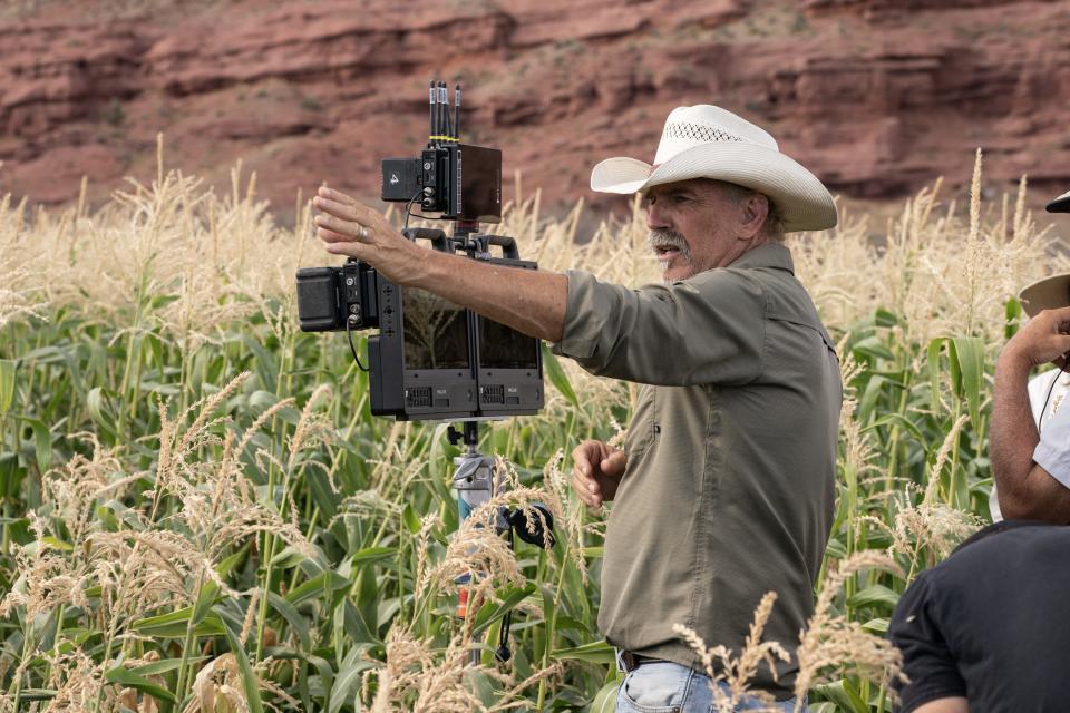 Kevin Costner directing next to a monitor