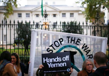 FILE PHOTO: Demonstrators from the Stop The War Coalition stage the protest against the killing of journalist Jamal Khashoggi, war in Yemen and UK arms sales to Saudi Arabia outside the Saudi Arabian Embassy in London, Britain, October 25 2018. REUTERS/Henry Nicholls/File Photo