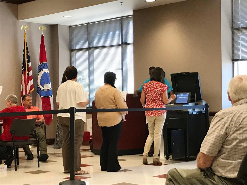 Officials enter ballots at the Etowah County Courthouse during the certification process on Tuesday, May 31, 2022, for the recent primary elections