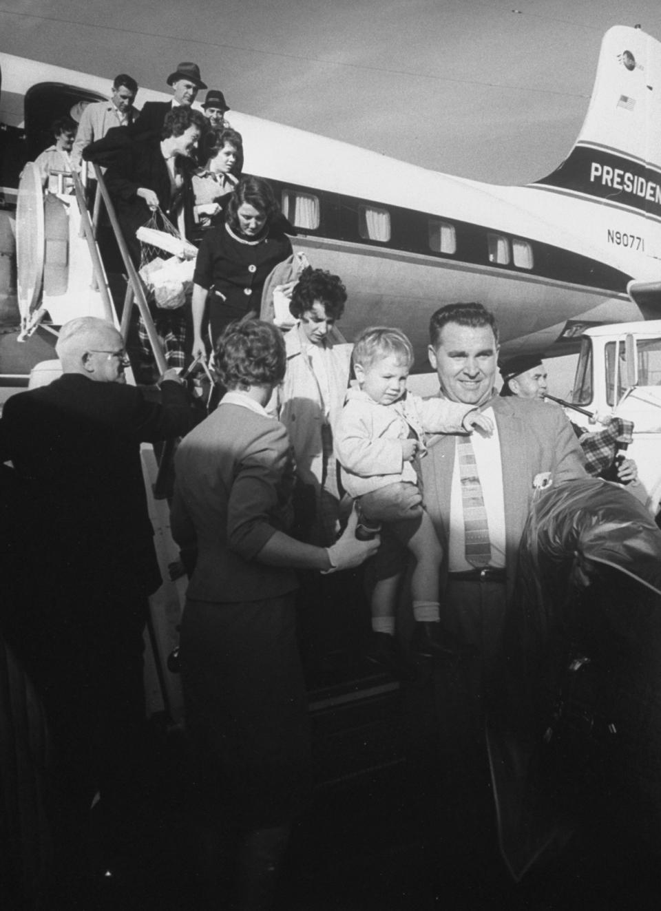 Passengers getting off of a tardy chartered plane on Oct. 1, 1961.&nbsp;