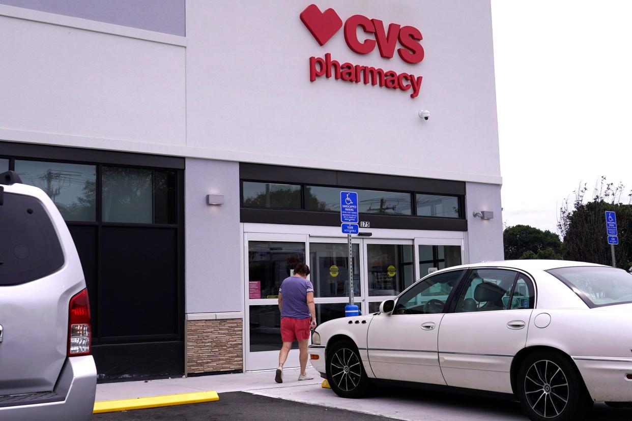 A customer walks into a CVS Pharmacy store, Tuesday, Aug. 3, 2021.