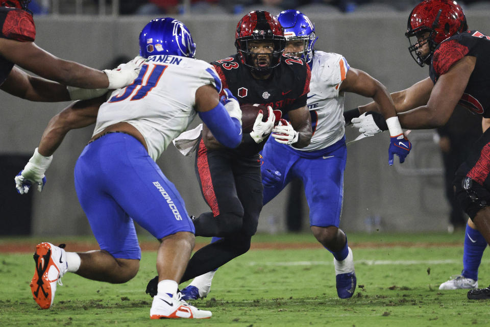 San Diego State running back Kenan Christon (23) carreis the ball against Boise State safety Zion Washington (31) during an NCAA college football game Friday, Sept. 22, 2023, in San Diego. (Meg McLaughlin/The San Diego Union-Tribune via AP)