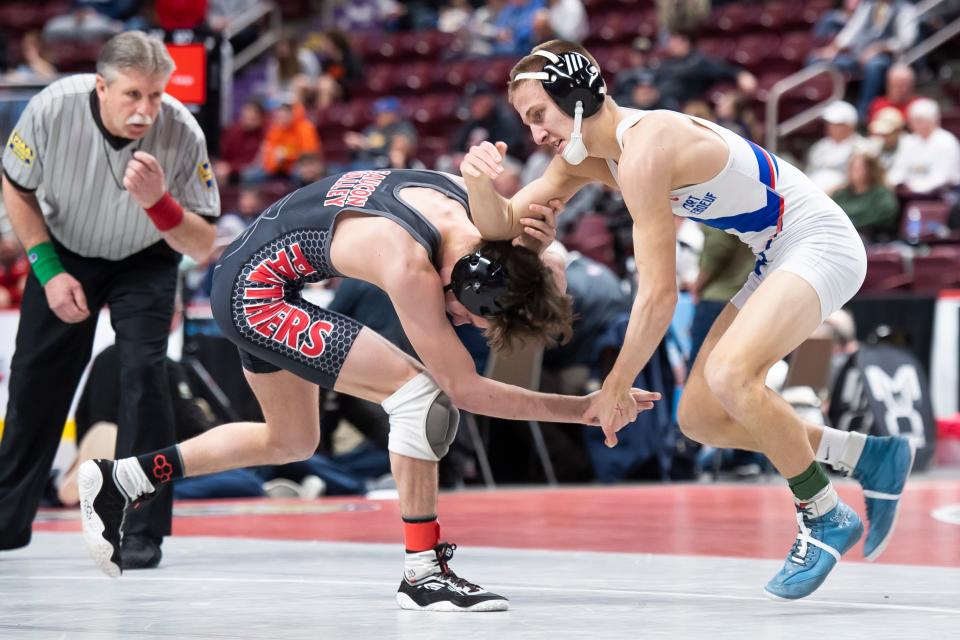 Fort LeBoeuf's Jake Bennett (right) avoids a shot from Saucon Valley's Aiden Grogg during a 121-pound first round bout at the PIAA Class 2A Wrestling Championships at the Giant Center on March 9, 2023, in Derry Township. Grogg won by decision, 1-0.