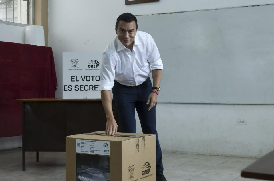 President Daniel Noboa casts his vote in a referendum to endorse new security measures to crackdown on criminal gangs responsible for increasing violence, in Olon, Ecuador, Sunday, April 21, 2024. (AP Photo/Cesar Munoz)