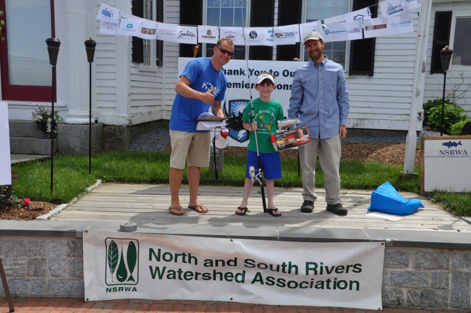Winning anglers collect their prizes in the 2018 fishing competition.