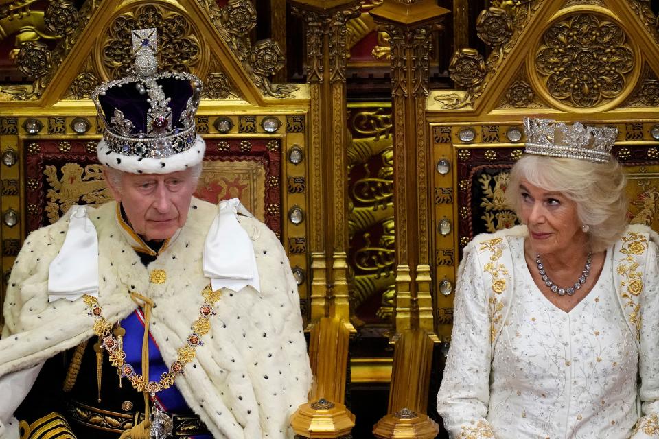 Britain’s King Charles III sits beside Britain’s Queen Camilla, wearing the George IV State Diadem as he reads the King’s speech.