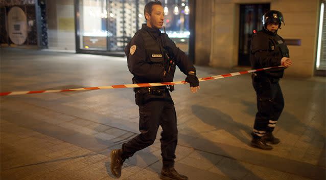 Police officers have told locals to stay out of the area. Photo: AP