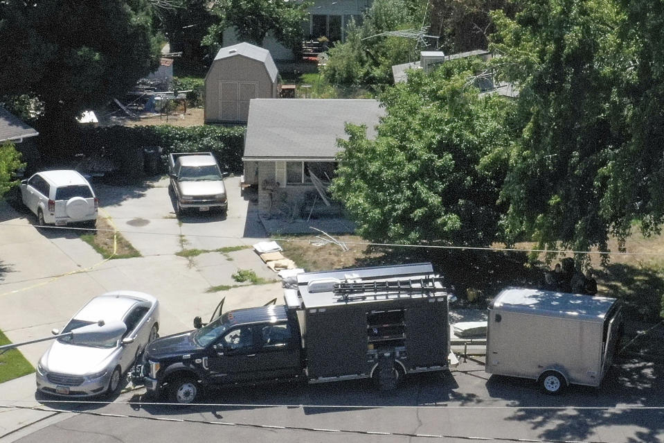 Law enforcement investigate the scene of a shooting involving the FBI in Provo, Utah, on Wednesday, Aug. 9, 2023. A Utah man accused of making violent threats against President Joe Biden was shot and killed by FBI agents hours before the president was expected to land in the state Wednesday, authorities say. The shooting happened around 6:15 a.m. as special agents tried to serve a warrant on the home of Craig Deleeuw Robertson in Provo, south of Salt Lake City. (Laura Seitz/The Deseret News via AP)