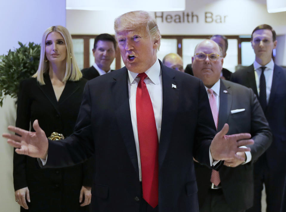 U.S. President Donald Trump reacts after addressing the World Economic Forum in Davos, Switzerland, Tuesday, Jan. 21, 2020. The 50th annual meeting of the forum will take place in Davos from Jan. 21 until Jan. 24, 2020. Left is Ivanka Trump. (AP Photo/Markus Schreiber)