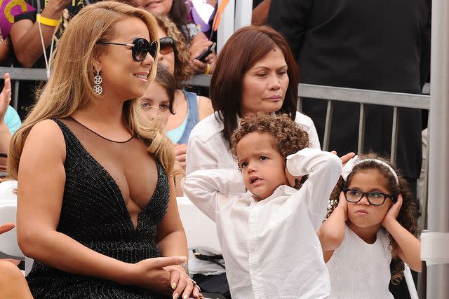 <p>Jason LaVeris/FilmMagic</p> Mariah Carey and her twins at her Walk of Fame Ceremony in 2015