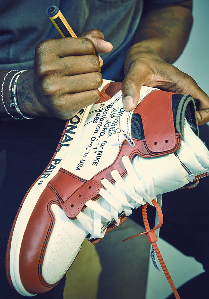 Virgil Abloh signing his Air Jordan 1 at FN’s New York City office in 2017. - Credit: ANDREW BOYLE