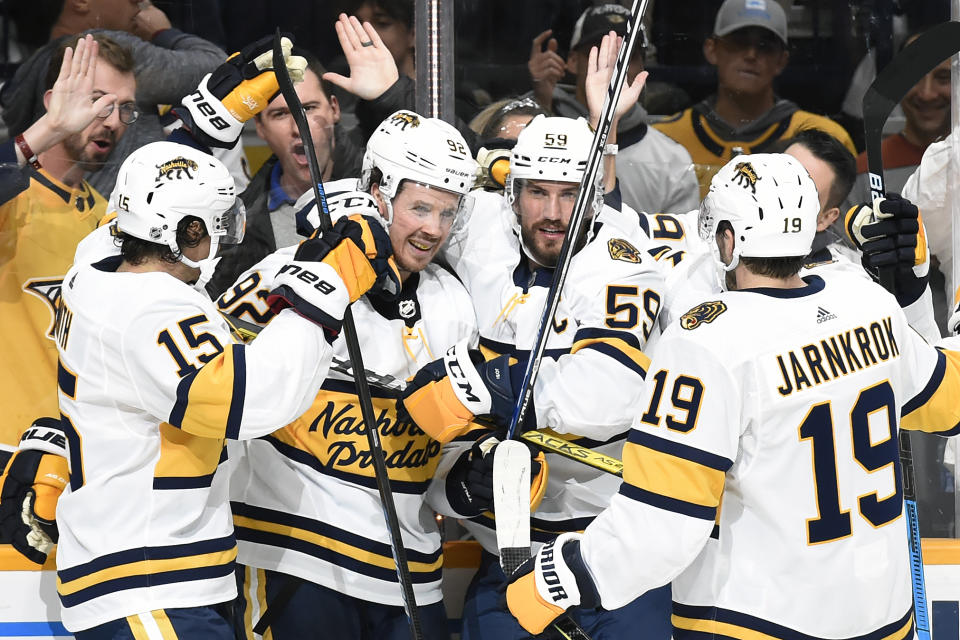 Nashville Predators center Ryan Johansen (92) is congratulated by teammates after scoring against the Buffalo Sabres during the second period of an NHL hockey game Saturday, Jan. 18, 2020, in Nashville, Tenn. (AP Photo/Mark Zaleski)