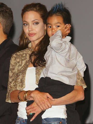 <p>Pascal Le Segretain/Getty</p> Angelina Jolie with her son Maddox at the World Premiere of "Shark Tale" as part of the 61st Venice Film Festival on Sept. 10, 2004.