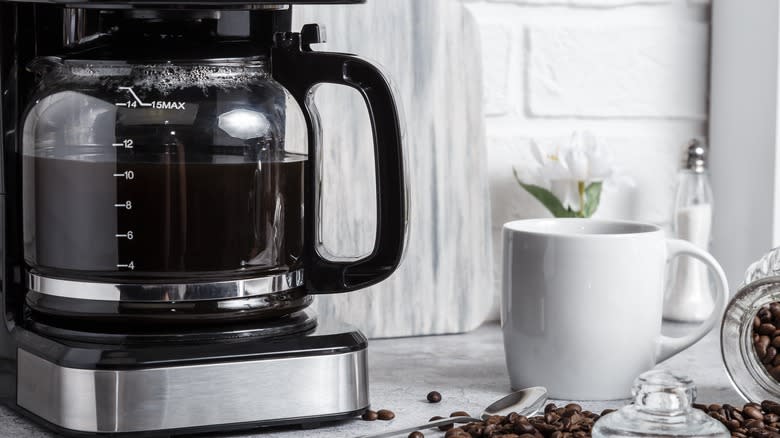 coffee maker on counter with mug