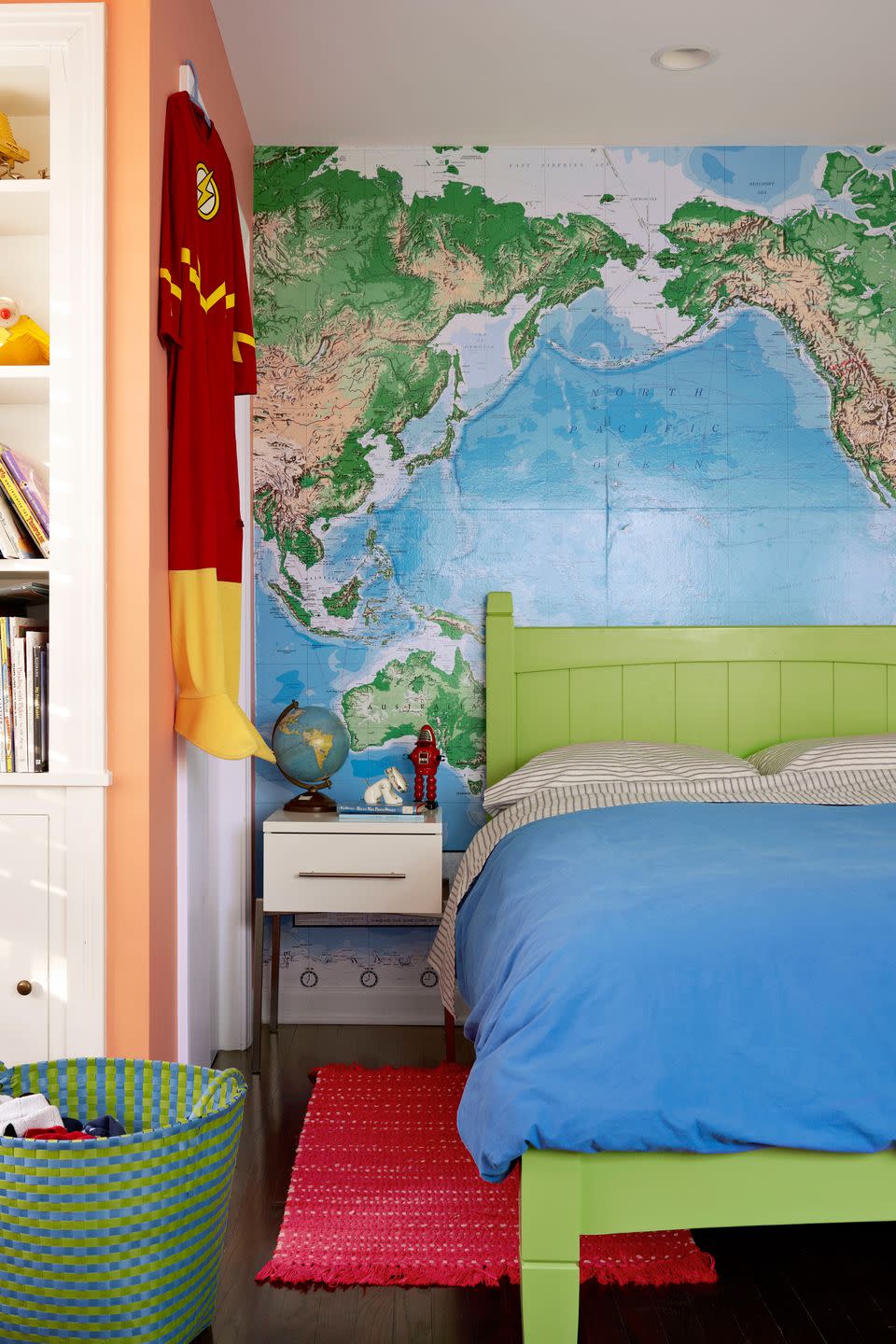 bedroom with map on wall and green bed